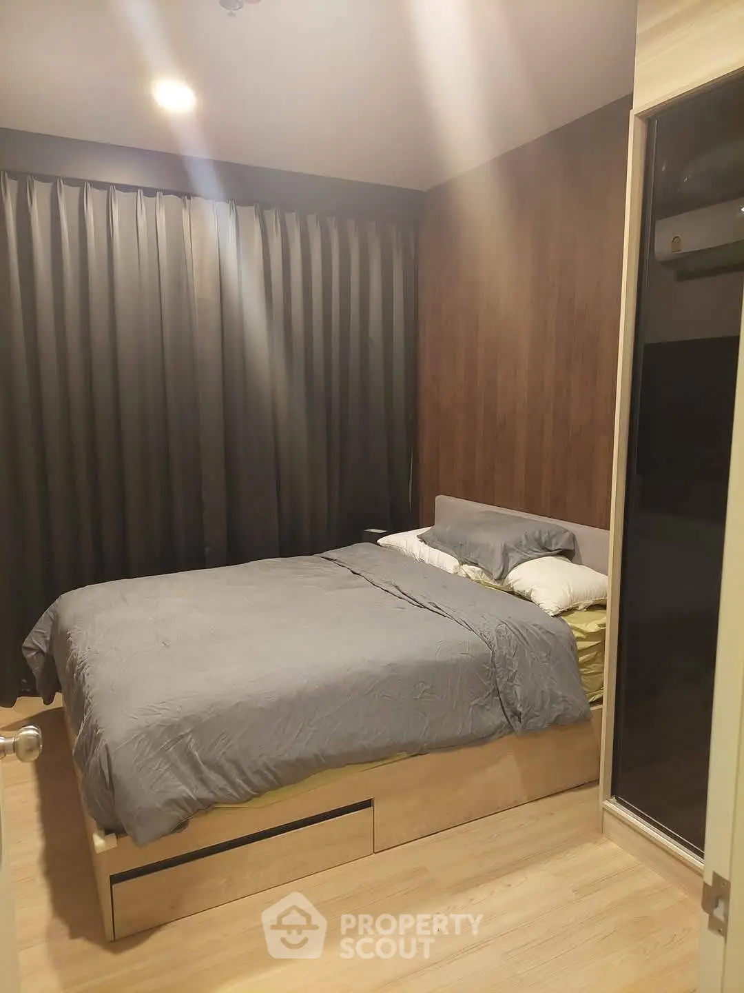 Cozy bedroom with modern decor and ample natural light