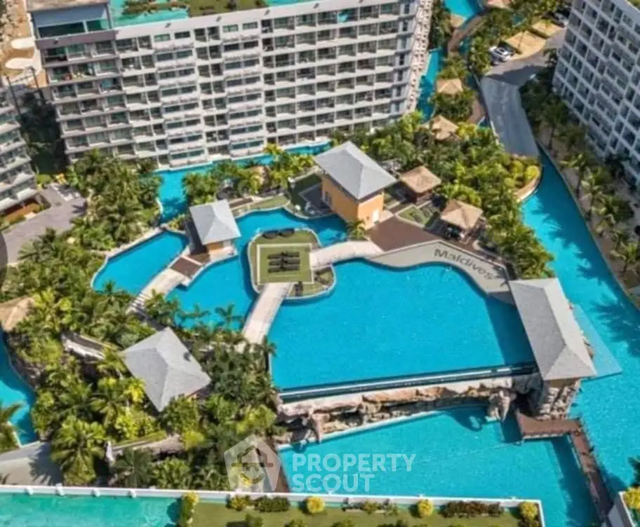 Luxurious resort-style pool area with lush landscaping and modern architecture.