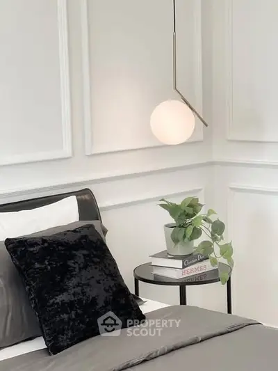 Elegant bedroom corner with modern lighting and stylish decor