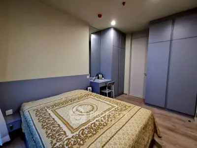 Cozy bedroom with elegant decor and ample storage space