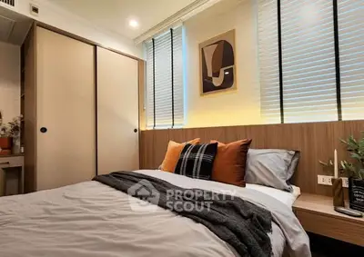 Cozy bedroom with modern decor and ample natural light