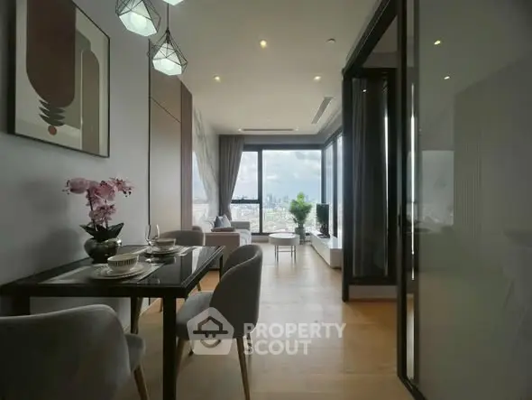 Luxurious open-plan living room with stunning city view and elegant dining area.