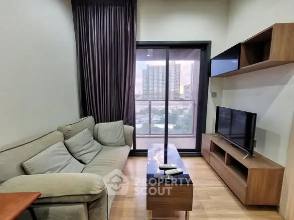 Modern living room with cozy sofa and city view balcony
