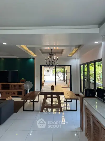 Spacious modern living room with elegant dining area and large windows