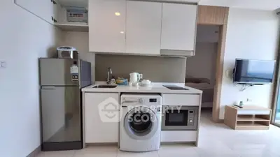 Modern compact kitchen with appliances in a stylish apartment
