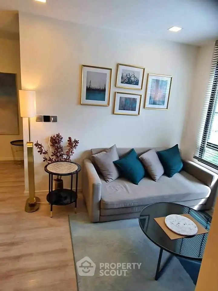 Chic living room with modern decor, cozy sofa, and stylish artwork, perfect for urban living.