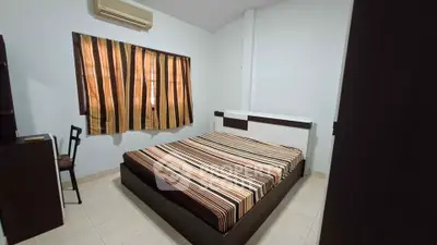 Spacious bedroom with modern furnishings and air conditioning unit