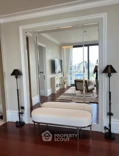 Luxurious living room with city view, elegant decor, and modern furniture