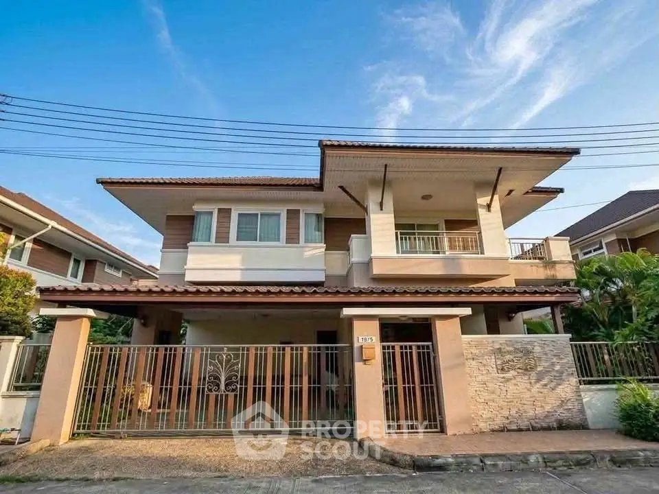 Stunning two-story house with spacious balcony and modern design in a serene neighborhood.