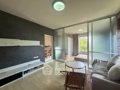 Modern living room with glass partition and cozy furniture