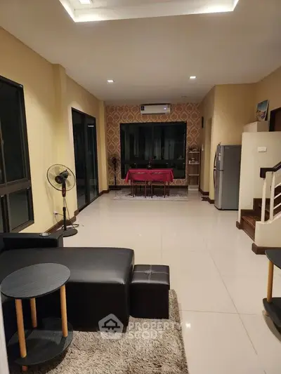 Spacious modern living room with elegant dining area and stylish furniture