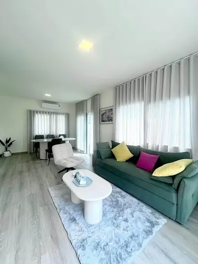 Spacious modern living room with stylish decor and natural light