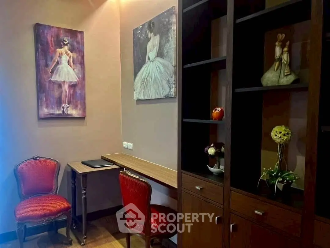 Charming study nook with elegant decor and stylish artwork, perfect for a cozy home office setup.