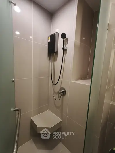 Modern bathroom shower with sleek design and built-in shelf