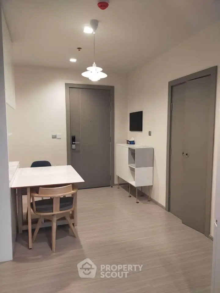 Modern minimalist dining area with sleek furniture and neutral tones