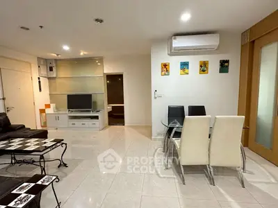 Spacious living room with modern furniture and air conditioning in a stylish apartment.