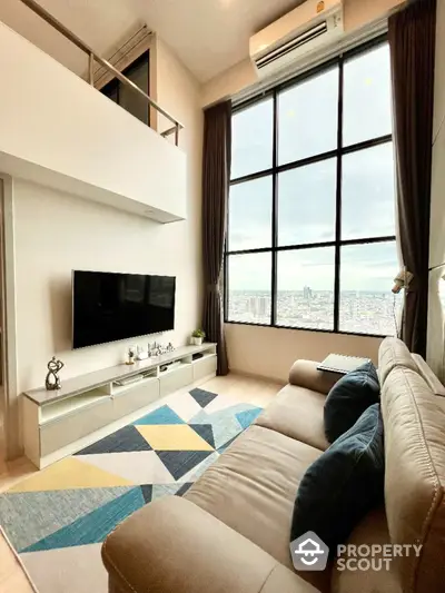 Modern living room with high ceiling and city view, featuring cozy sofa and stylish decor.