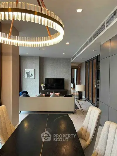 Luxurious modern living room with elegant chandelier and stylish decor
