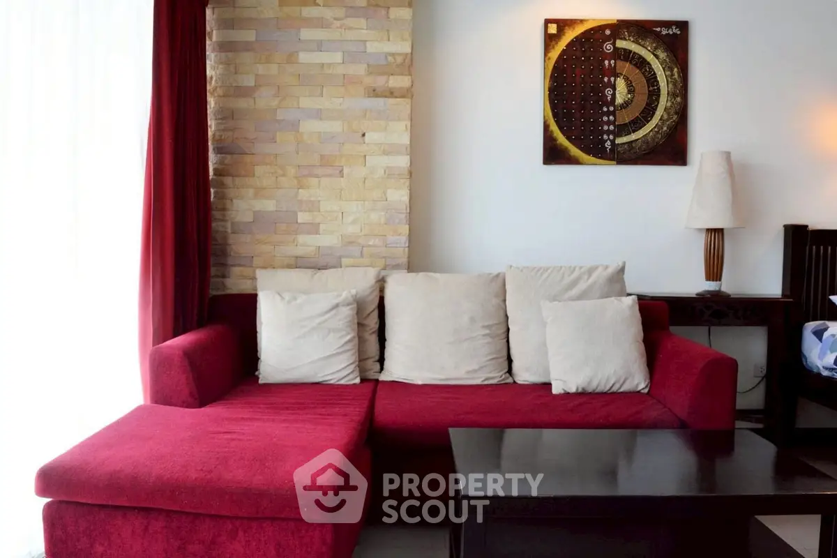 Stylish living room with red sofa and modern decor