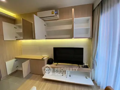 Modern living room with open cabinets and sleek TV setup