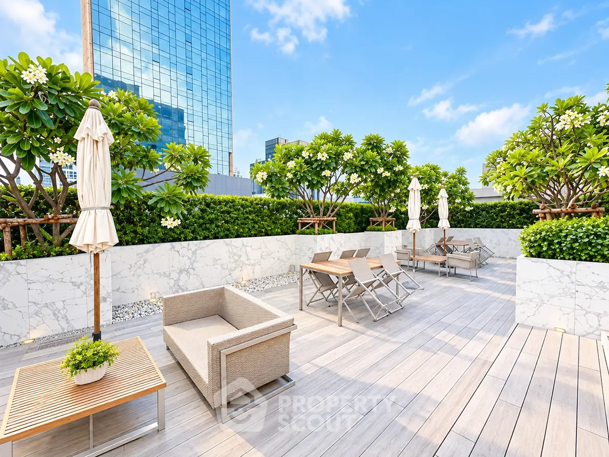 Luxurious rooftop terrace with modern seating and lush greenery, perfect for relaxation and entertainment.