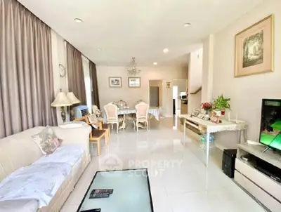 Spacious living room with elegant dining area and modern decor