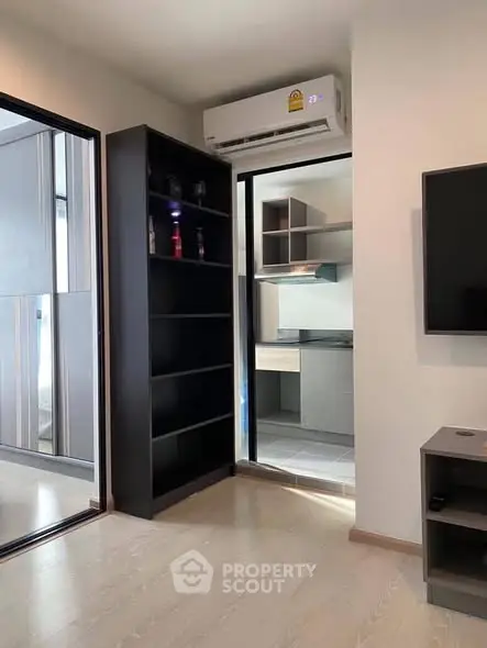 Modern apartment interior with sleek shelving and air conditioning