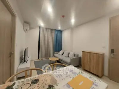 Modern living room with cozy sofa and stylish decor in a contemporary apartment.