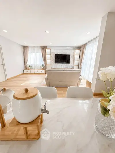 Spacious modern living room with elegant decor and natural light