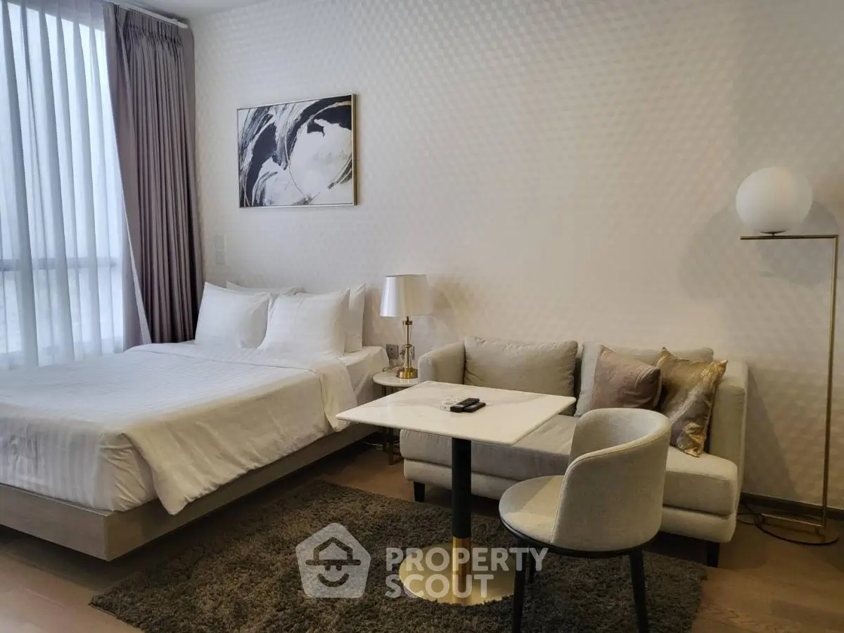 Modern studio apartment with cozy bed and stylish decor