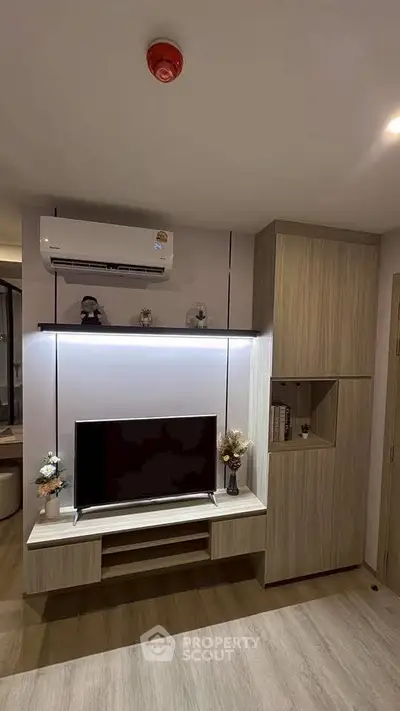Modern living room with sleek TV setup and stylish storage solutions