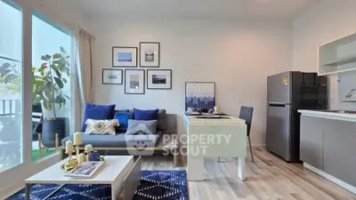 Modern living room with stylish decor and open kitchen layout