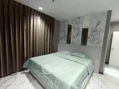 Modern bedroom with marble accents and elegant drapery