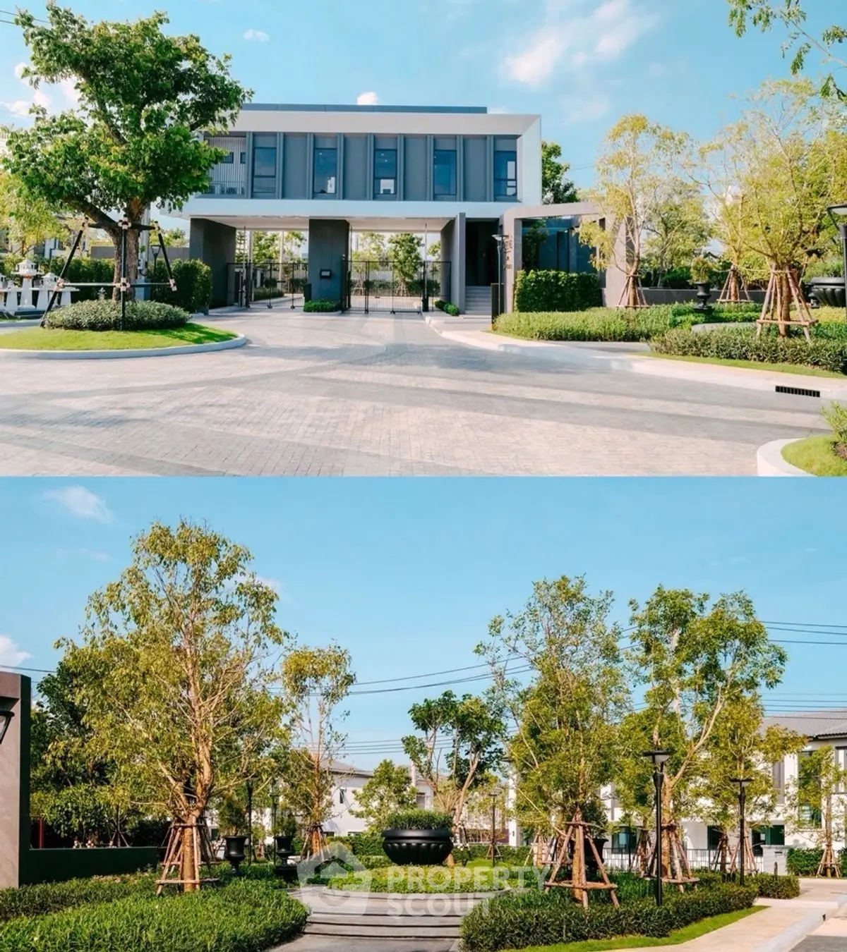 Modern building entrance with lush landscaped garden and clear blue sky.