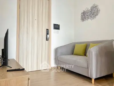 Modern living room with stylish gray sofa and wooden accents