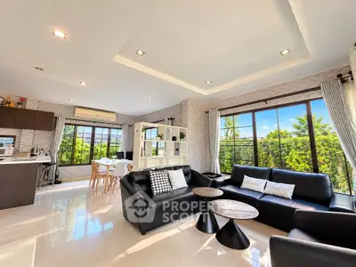 Spacious modern living room with large windows and stylish furniture