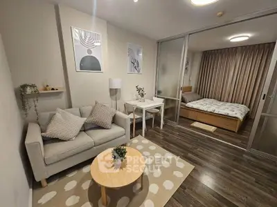 Modern studio apartment with cozy living area and stylish bedroom