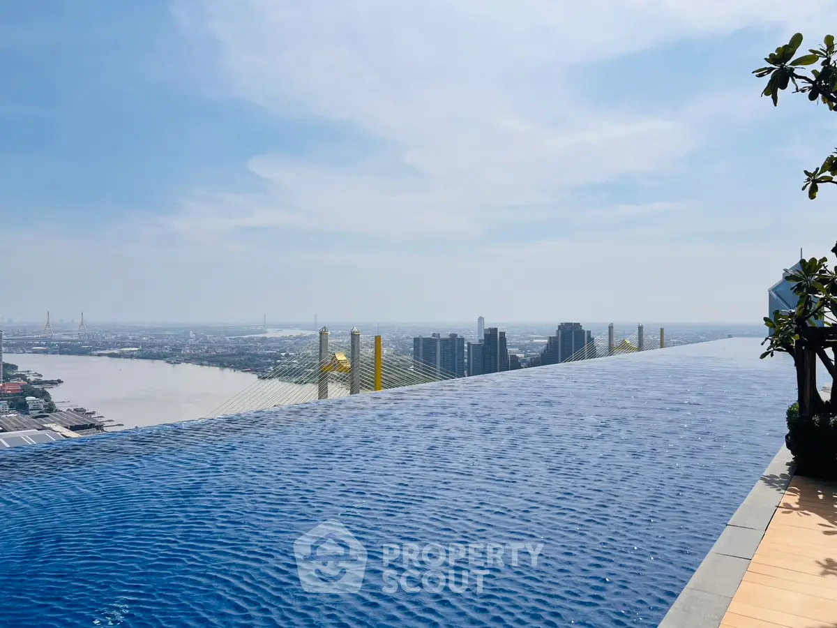 Stunning rooftop infinity pool with breathtaking city and river views.