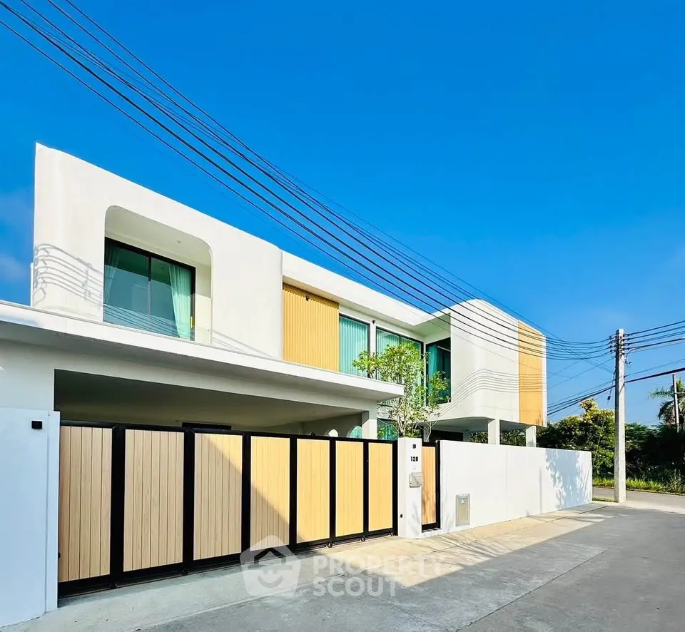 Modern two-story house with sleek design and spacious driveway