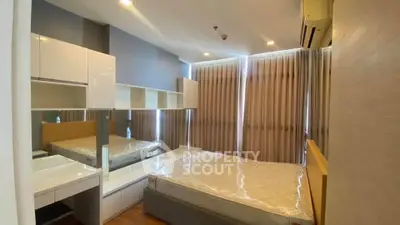Modern bedroom with sleek design, featuring built-in storage and large windows for natural light.