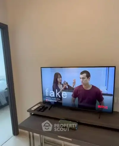 Modern living room with sleek TV setup and minimalist decor