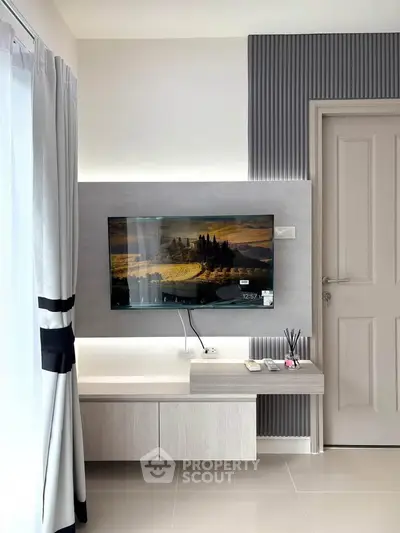Modern living room with sleek TV setup and elegant decor