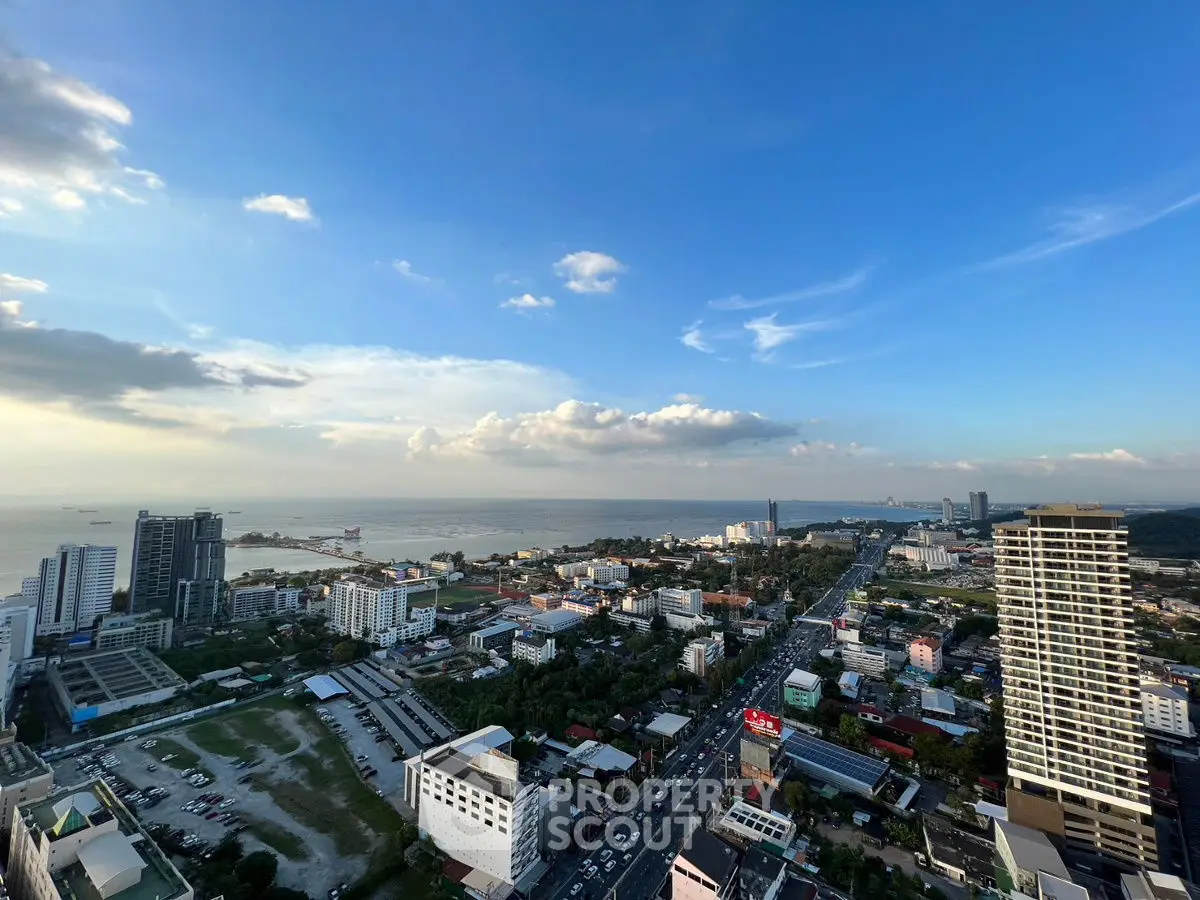 Stunning high-rise cityscape with ocean view, perfect for urban living enthusiasts.