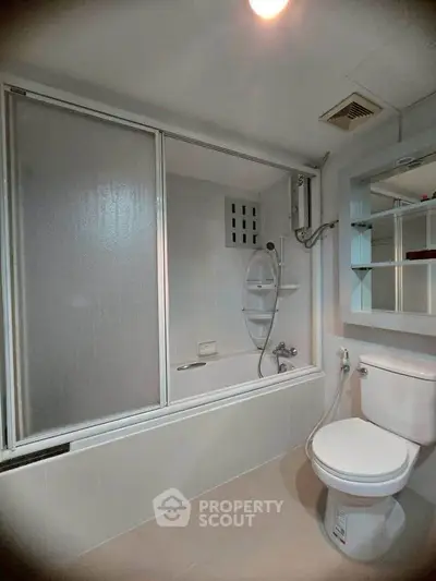 Modern bathroom with bathtub and shower in sleek design