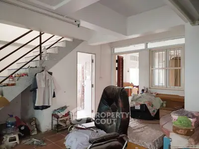 Cozy interior with staircase and casual seating area in a residential home