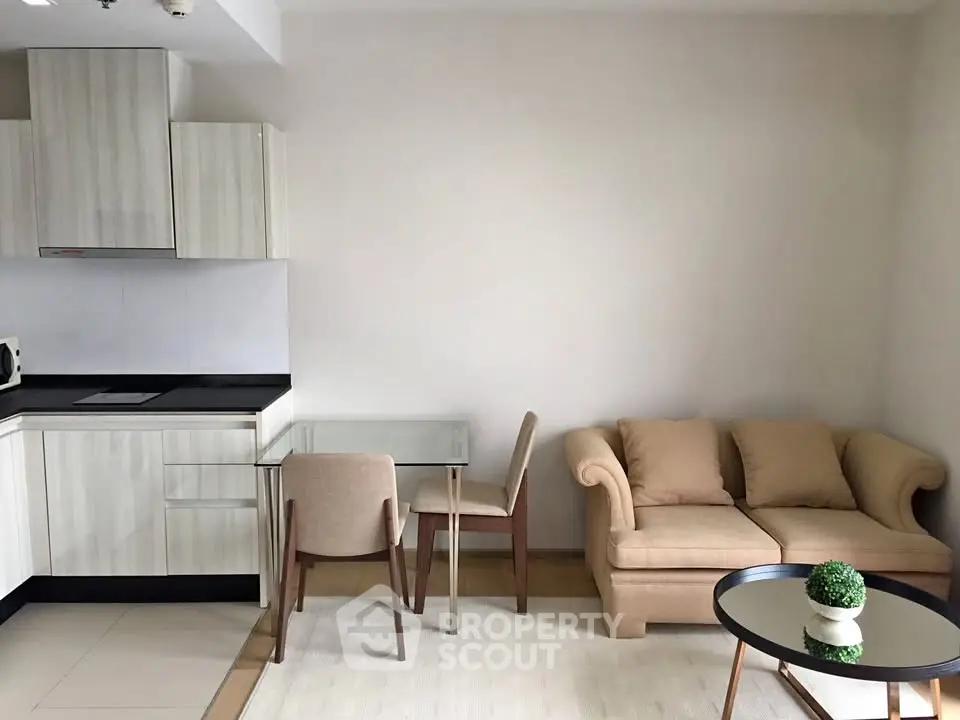 Modern living room with cozy sofa and stylish kitchen area