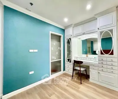 Spacious bedroom with elegant built-in vanity and ample storage
