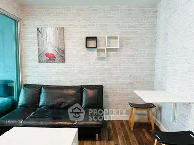 Modern living room with stylish black sofa and white brick wall decor