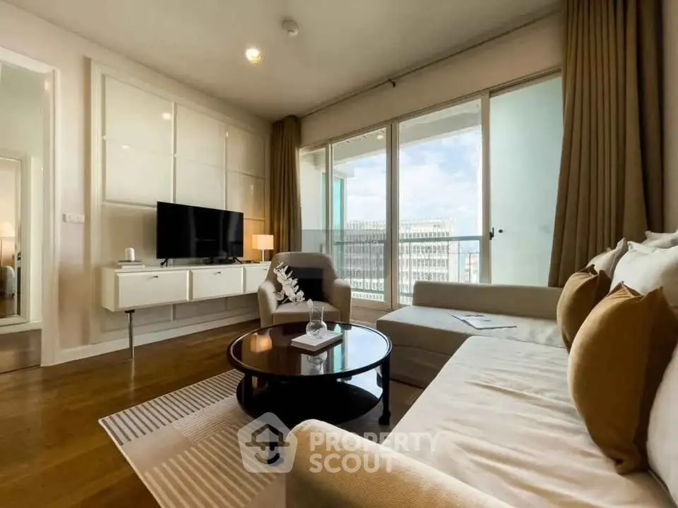 Spacious modern living room with large windows and elegant decor