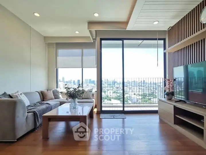Spacious living room with city view and modern decor